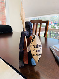 A child in Uganda crafted this statue, named “The Protector,” for Lin Hutaff. She keeps it on her desk as a reminder of the school lunch program.
