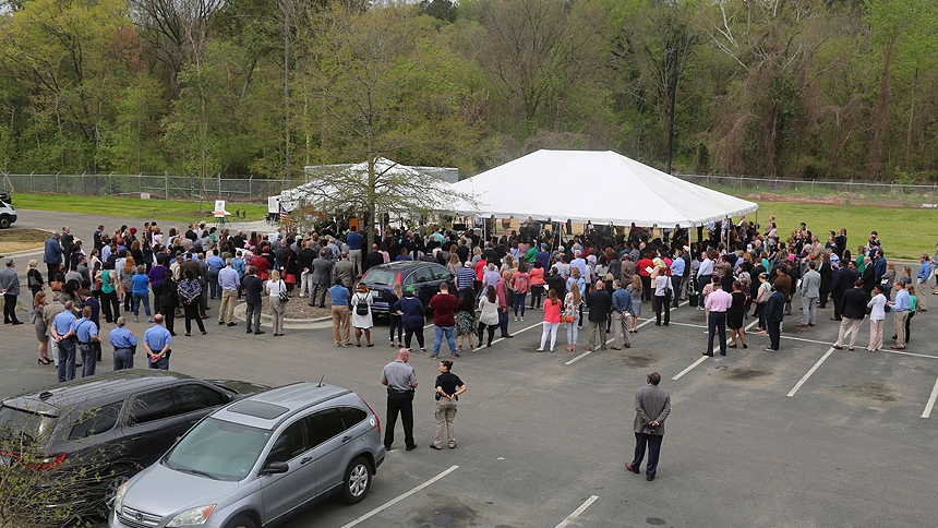 Hundreds attended the April 8 ribbon cutting program, which was held just outside the building where Oak City Cares operates. 