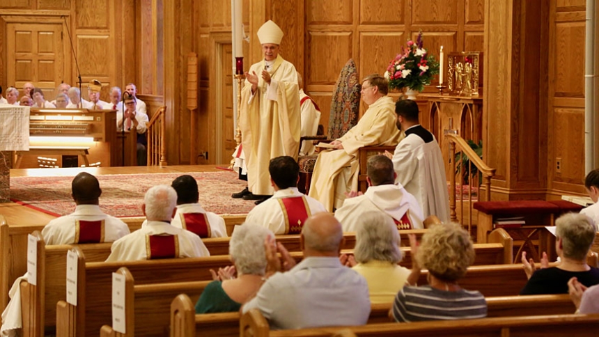 Father John Forbes is installed at Sacred Heart in Pinehurst June 28.