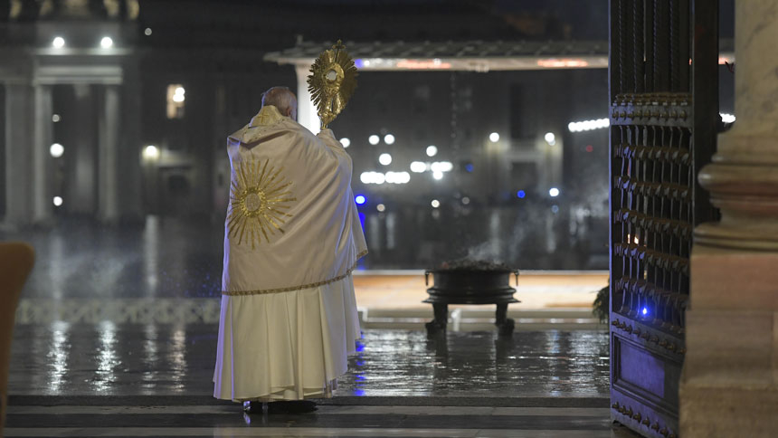 Pope Francis holds the monstrance as he delivers his extraordinary blessing "urbi et orbi" (to the city and the world) during a prayer service in the portico of St. Peter's Basilica at the Vatican March 27, 2020.
