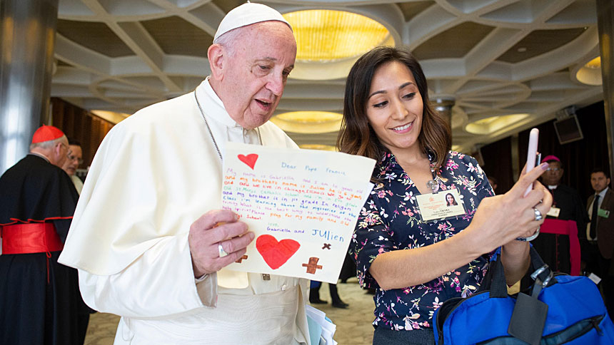Pope Francis meets Yadira Vieyra, a synod delegate from Chicago, before a session of the Synod of Bishops on young people, the faith and vocational discernment in 2018 at the Vatican. (CNS photo/Vatican Media)