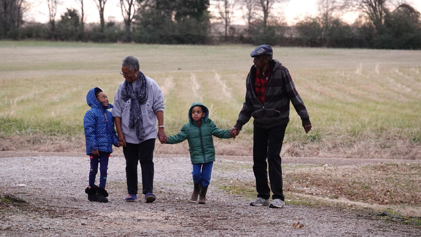 Joyce Christian, along with her husband, Will, walk with their grandchildren in Somerville, Tenn., in this undated photo. She is a retired nurse who encourages African Americans and other people of color to get the COVID-19 vaccine. (CNS photo/Karen Pulfer Focht)
