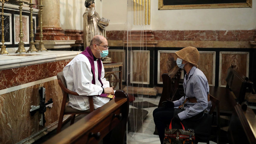 A priest hears confession inside the cathedral in Valencia, Spain, May 19, 2020, amid the coronavirus pandemic. For the Christian, fasting during Lent is ultimately about fasting from sin. (CNS photo/Nacho Doce, Reuters)