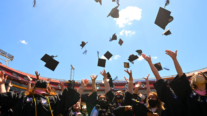 Graduates of The Catholic University of America celebrate during the school's 132nd annual commencement ceremony at FedExField in Landover, Md., May 15, 2021. (CNS photo/courtesy The Catholic University of America)