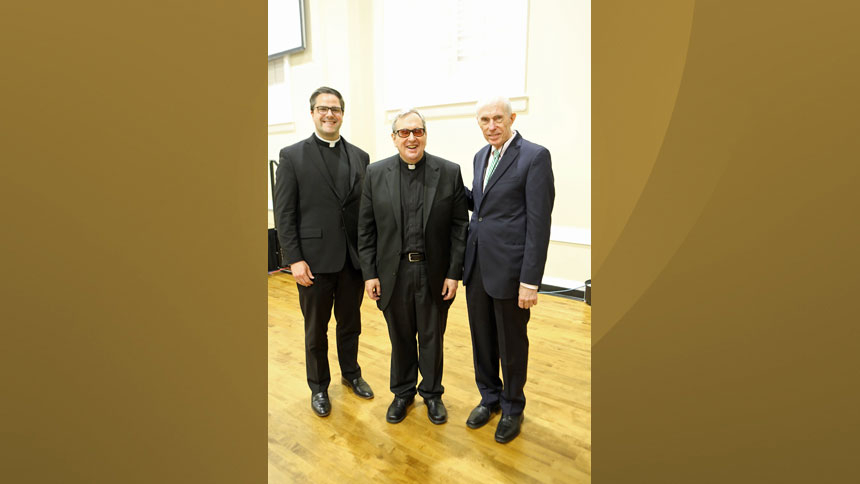 Father Michael Burbeck, Father Robert Spitzer and Bob Luddy pose for a photo.