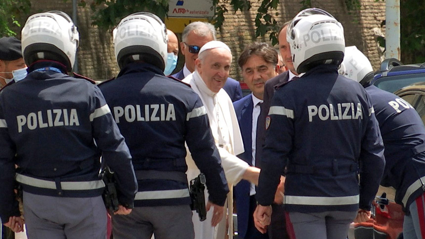 Pope Francis greets police officers before entering the Vatican after being discharged from Rome's Gemelli hospital following his recovery from colon surgery in this screengrab taken from a video July 14, 2021. (CNS photo/Cristiano Corvino, Reuters TV screengrab)