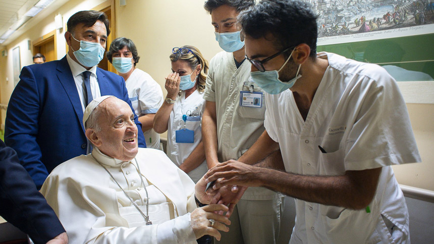 Pope Francis gives a rosary to a member of the medical staff at Gemelli hospital in Rome July 11, 2021, as he recovers following scheduled colon surgery. Earlier the pope led the Angelus from a balcony at the hospital. (CNS photo/Vatican Media via Reuters)