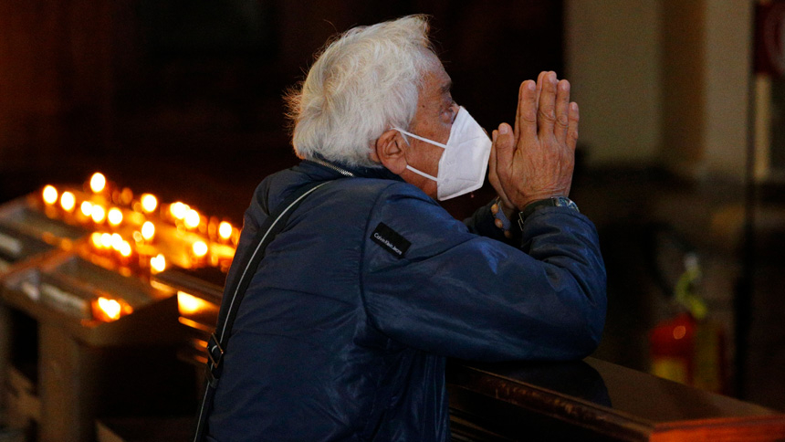 A man wearing a mask for protection from COVID-19 prays in the Basilica of Santa Maria degli Angeli in Assisi, Italy, in this Oct. 2, 2020, file photo. Prayer is about working on the relationship with God, which means going beyond oneself. (CNS photo/Paul Haring)