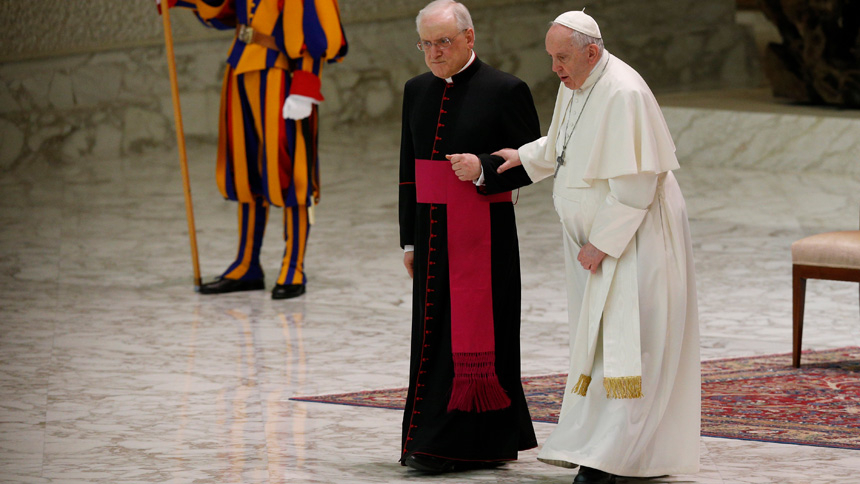 Pope Francis walks with Msgr. Leonardo Sapienza, an official of the Prefecture of the Papal Household, during his general audience in the Paul VI hall at the Vatican March 2, 2022. (CNS photo/Paul Haring)