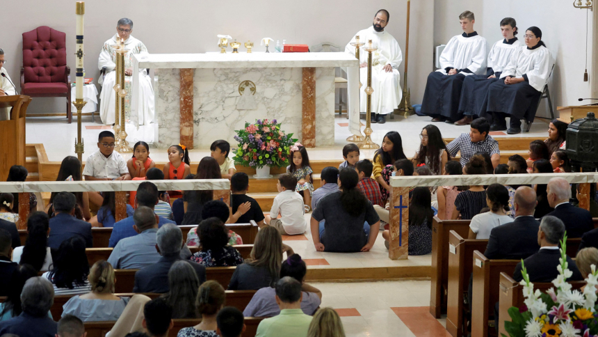 Children at Sacred Heart Catholic Church in Uvalde, Texas, attend Mass with President Joe Biden and first Lady Jill Biden May 29, 2022. A gunman killed 19 children and two teachers at Robb Elementary School May 24. (CNS photo/Jonathan Ernst, Reuters)