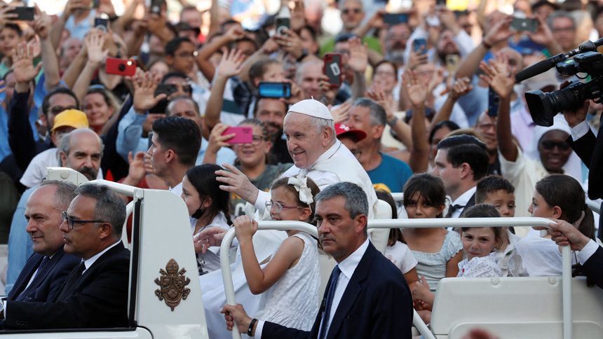 Children ride in the popemobile with Pope Francis as he greets the crowd before Mass in St. Peter's Square during the World Meeting of Families at the Vatican June 25, 2022. (CNS photo/Remo Casilli, Reuters)