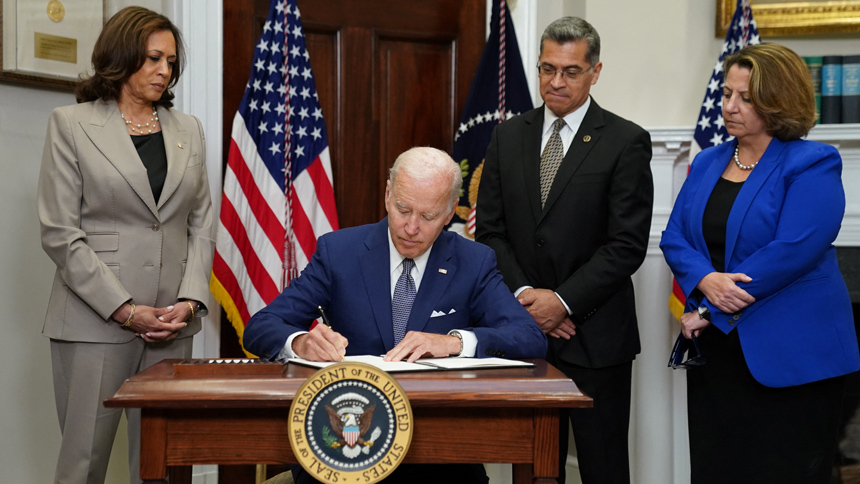 President Joe Biden signs an executive order at the White House in Washington July 8, 2022, that he said would help safeguard women's access to abortion and contraceptives. He stated the order was a necessary response to the Supreme Court's June 24 decision overturning the court's 1973 Roe v. Wade decision that legalized abortion nationwide. Also pictured: Vice President Kamala Harris, Health & Human Services Secretary Xavier Becerra, Deputy Attorney General Lisa Monaco. (CNS photo/Kevin Lamarque, Reuters)