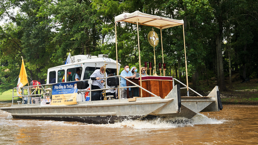 A boat participates in the annual Fête-Dieu du Têche in the Diocese of Lafayette, La., Aug. 15, 2021. The 40-mile eucharistic procession by boat and on foot along the Bayou Têche takes place on the feast of the Assumption of Mary. The 2022 procession comes about two months after the launch of the U.S. Catholic Church's three-year National Eucharistic Revival. (CNS photo/courtesy Father Michael Champagne)