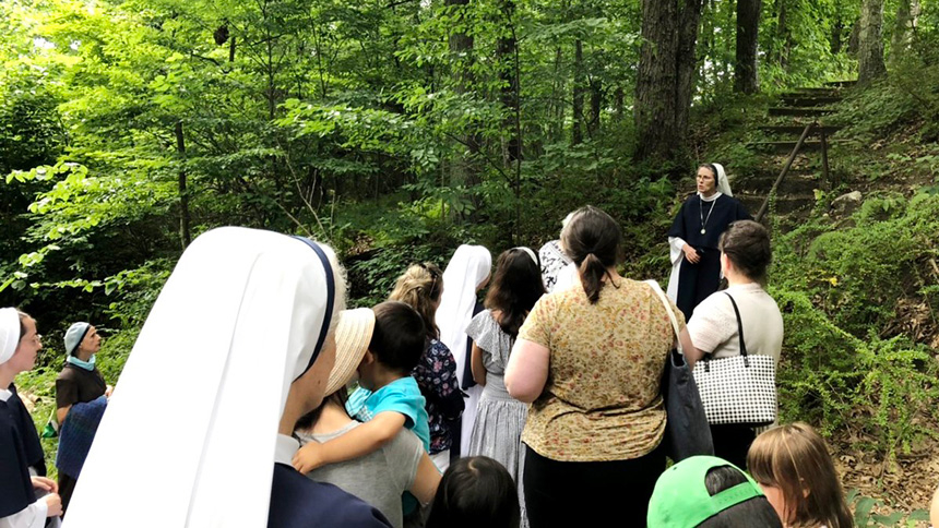 Sister Veronica Sullivan, a Sister of Life, talks about the "McGivney steps" near St. Thomas Cemetery in Thomaston, Conn., in early August 2022. Blessed Michael McGivney, a sainthood candidate, founded the Knights of Columbus in 1882. (CNS photo/Andrew Fowler)