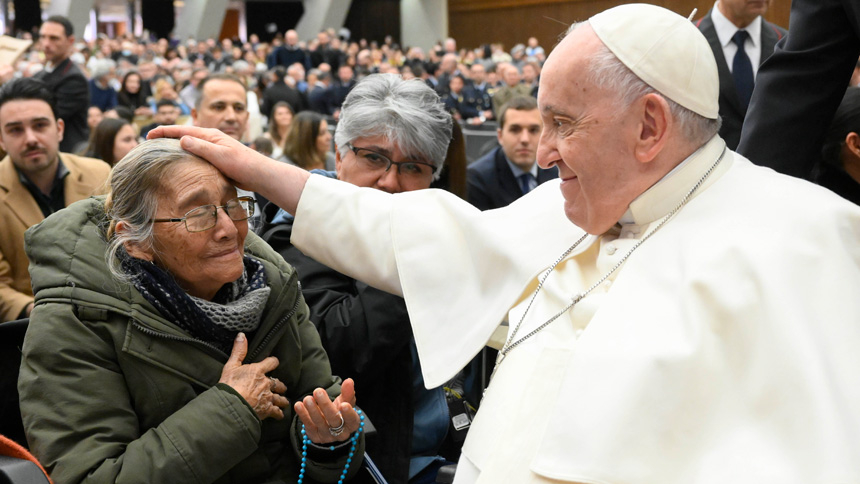 Pope Francis blesses a woman after his weekly general audience in the Vatican audience hall Feb. 15, 2023. (CNS photo/Vatican Media)