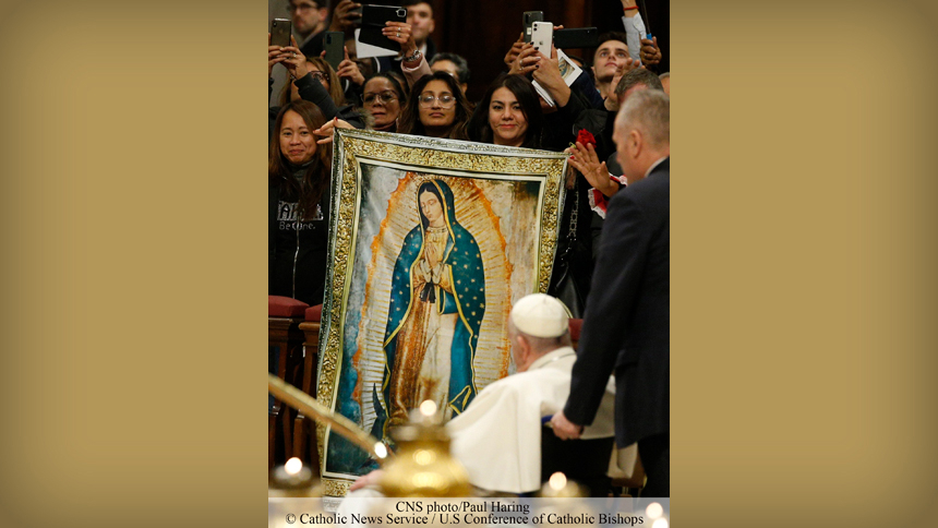Pope Francis passes a banner of Our Lady of Guadalupe as he leaves after presiding at Mass marking the feast of Our Lady of Guadalupe in St. Peter's Basilica at the Vatican Dec. 12, 2022. In the second year of his pontificate, Pope Francis began celebrating a public Mass on the feast day each year. (CNS photo/Paul Haring)