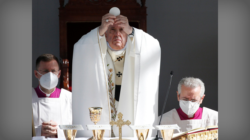 Pope Francis elevates the host as he celebrates Mass at the GSP Stadium in Nicosia, Cyprus, in this Dec. 3, 2021, file photo. The pope's prayer intention for July is "For a Eucharistic life," and he encouraged Catholics to be "transformed" by participating in the Eucharist. (CNS photo/Paul Haring)