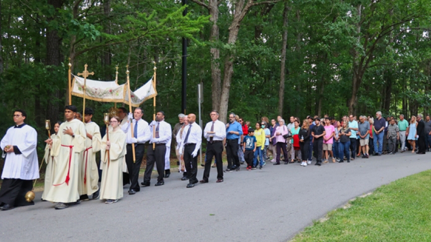 Carrying the Eucharist: St. Michael Parish holds procession at sunset