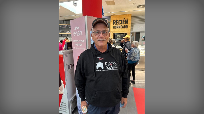Bishop Luis Zarama wearing his Diocese of Raleigh Centennial hoodie in Zaragoza, Spain