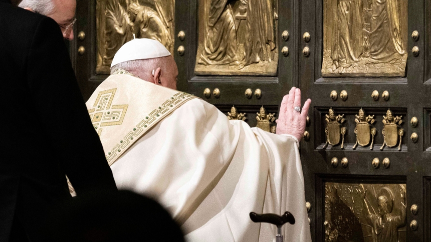Pope Francis pushes open the Holy Door of St. Peter's Basilica at the Vatican Dec. 24, 2024, inaugurating the Holy Year 2025. (CNS photo/Cristian Gennari, pool)