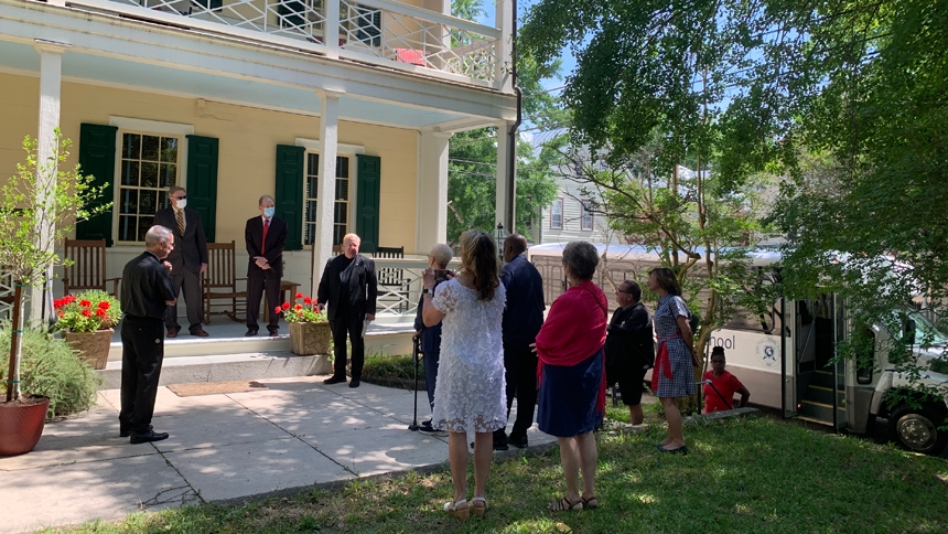 Bishop Luis Rafael Zarama and Father Tom Tully visit the Gaston House in 2021.