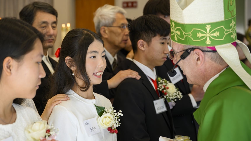 Bishop confirms 26 at St. Ha Sang Paul Jung
