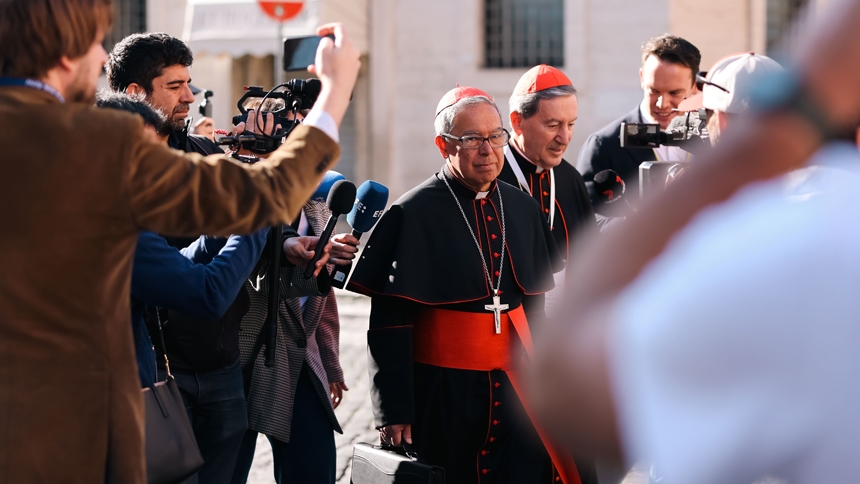 Cardinals Luis José Rueda Aparicio of Bogotá, Colombia, left, and Rubén Salazar Gómez of Bogotá, right, approach the Petriano entrance of the Vatican next to St. Peter's Square to attend the seventh general congregation meeting of cardinals April 30, 2025. (CNS photo/Kendall McLaren)