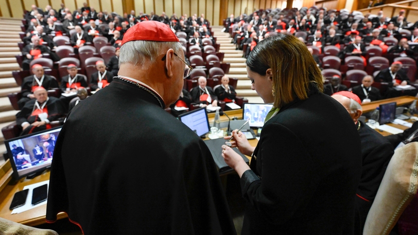 In the presence of members of the College of Cardinals in the New Synod Hall at the Vatican May 6, 2025, a woman defaces the papal fisherman's ring and the lead seal that had marked Pope Francis' letters. (CNS photo/Vatican Media)