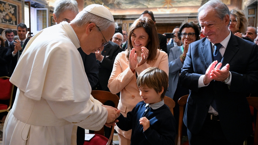 Pope Leo XIV greets a child after meeting with members of the Centesimus Annus Foundation in the Clementine Hall of the Apostolic Palace at the Vatican May 17, 2025. The foundation promotes Catholic social teaching. (CNS photo/Vatican Media)