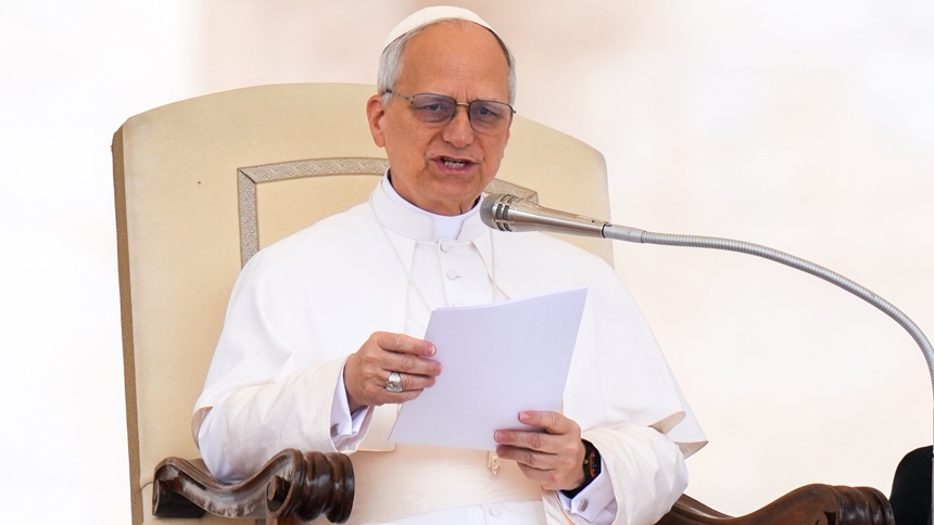 Pope Leo XIV talks to visitors during his first weekly general audience in St. Peter's Square at the Vatican May 21, 2025. (CNS photo/Lola Gomez)