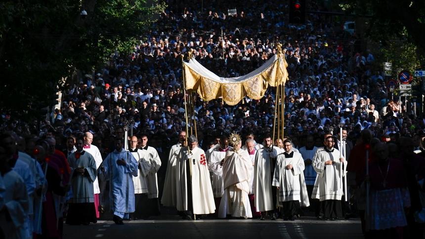 Sunlight shines on Pope Leo XIV as he carries a monstrance with the Blessed Sacrament in a Corpus Christi procession from Rome's Basilica of St. John Lateran to the Basilica of St. Mary Major June 22, 2025. (CNS photo/Vatican Media)