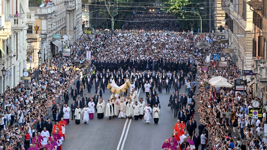 Under a canopy, Pope Leo XIV carries the Eucharist in a monstrance during a Corpus Christi procession from Rome's Basilica of St. John Lateran to the Basilica of St. Mary Major June 22, 2025. Thousands of people participated in the procession behind the pope and thousands more lined the streets as the procession passed. (CNS photo/Vatican Media)