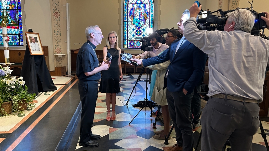 Bishop Luis Zarama talks to the press
