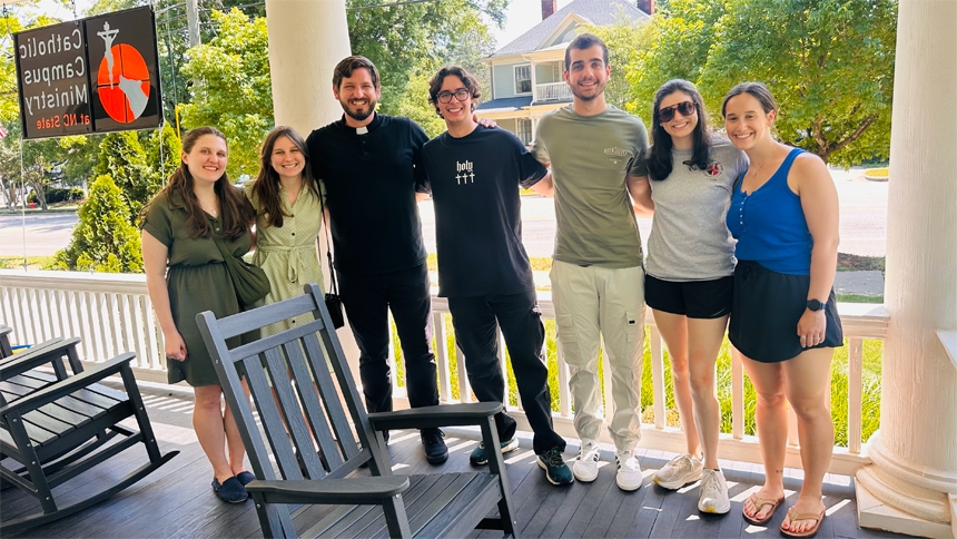 On the day of Pope Leo XIV’s election, Father Daniel Rolczynski, L.C. (third from left) smiles alongside those he serves. (Photo by Dani Irving)