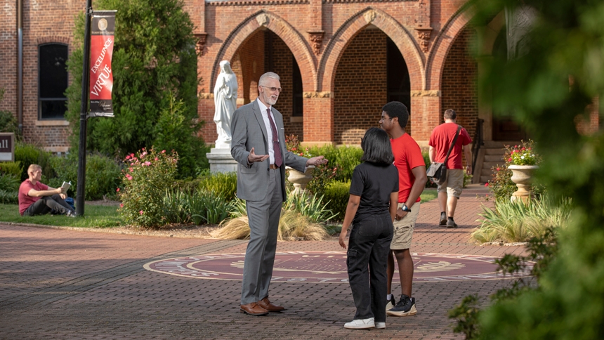 William Thierfelder speaks with students on the campus of Belmont Abbey College. (photo: SEAN BUSHER / Belmont Abbey College)