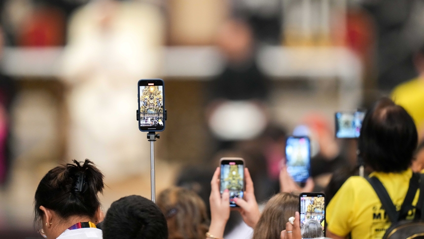 Participants use their cellphones to record Pope Leo XIV as he addresses them during the Jubilee of Digital Missionaries and Catholic Influencers after Cardinal Luis Antonio Tagle celebrated Mass in St. Peter’s Basilica at the Vatican July 29, 2025. (CNS photo/Lola Gomez)