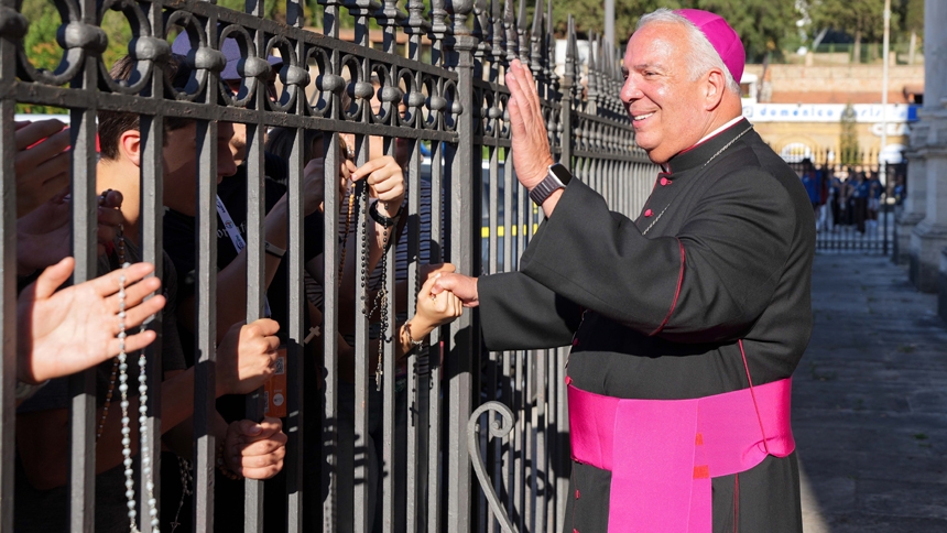 Archbishop Nelson J. Perez of Philadelphia greets young pilgrims who ask him to bless their rosaries outside the Basilica of St. Paul Outside the Walls in Rome before the USA National Jubilee Pilgrim Gathering July 30, 2025. The event was part of the Jubilee of Youth. (CNS photo/Lola Gomez)