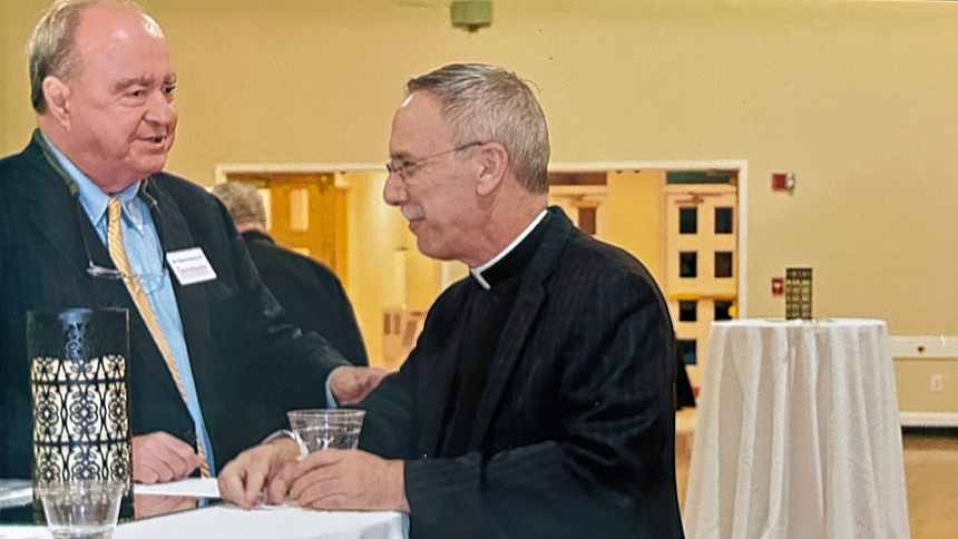 Charlie Powers and Bishop Luis Rafael Zarama talk during a diocesan event.  