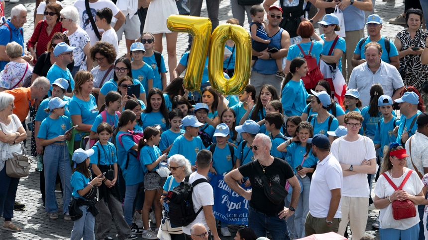 A group of children from an Italian parish holds up two gold mylar balloons of the numbers "7" and "0" as they join other visitors in St. Peter's Square at the Vatican for Pope Leo XIV's recitation of the Angelus prayer and to wish him a happy 70th birthday Sept. 14, 2025. (CNS photo/Vatican Media)