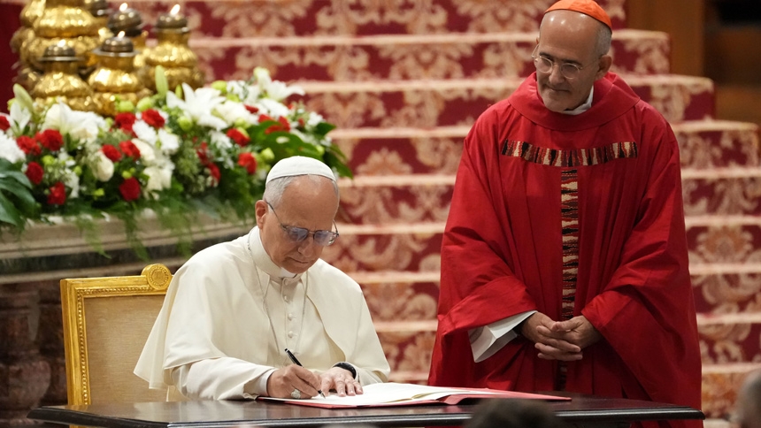 Pope Leo XIV signs the apostolic letter “Drawing New Maps of Hope," marking the 60th anniversary of the Vatican II declaration on Catholic education, which will be celebrated Oct. 28. The signing took place ahead of the Mass for with students from the pontifical universities of Rome in St. Peter's Basilica at the Vatican Oct. 27, 2025. (CNS photo/Lola Gomez)