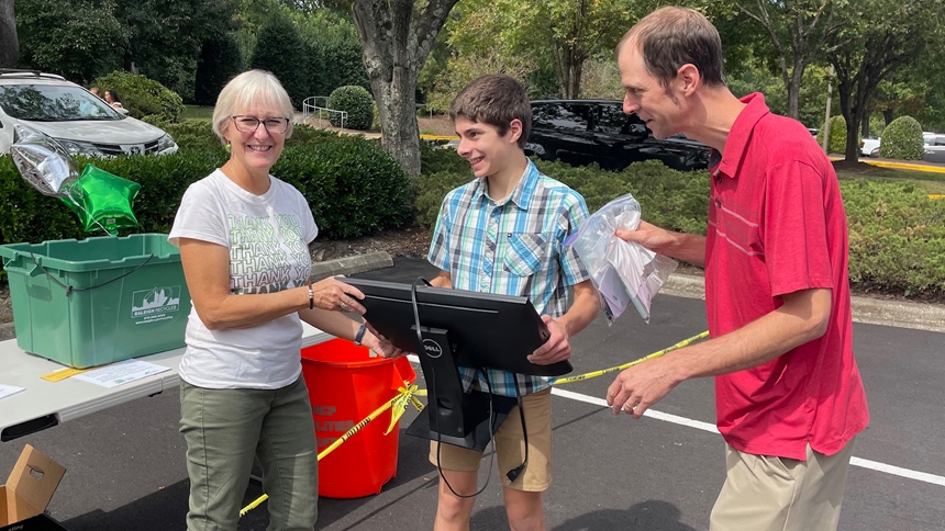 Volunteers accept electronic waste at St. Raphael Church in Raleigh.