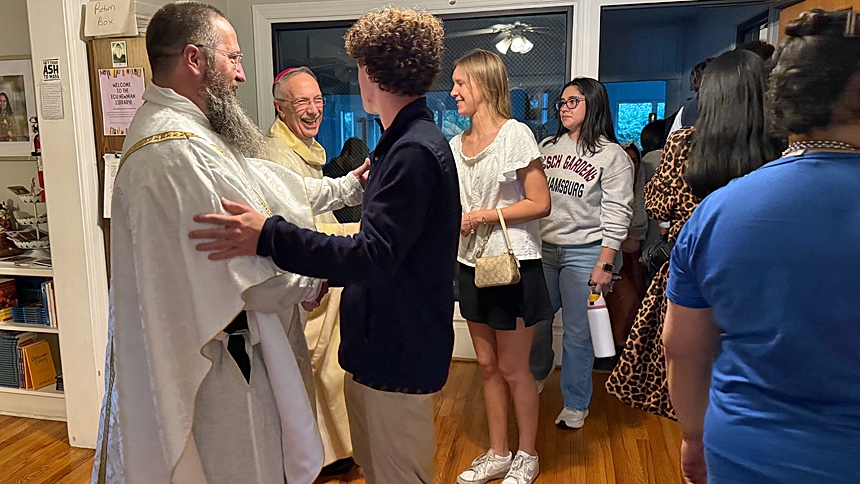 'One foot in Heaven': Bishop inspires students during visit to ECU Newman Center