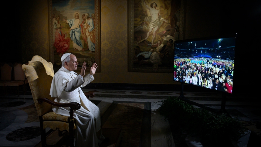 Pope Leo XIV waves at 16,000 young people gathered at the National Catholic Youth Conference in Indianapolis as he holds a livestreamed question-and-answer session with them from the Vatican Nov. 21, 2025. (CNS photo/Vatican Media)