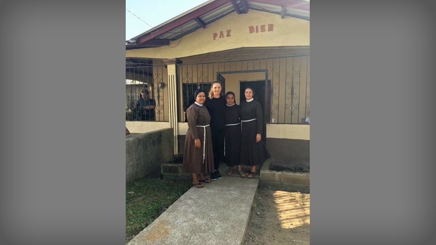 St. Michael’s parishioner Carolyn Schachte with religious sisters in front of their convent in Nueva Palestina, Honduras. 