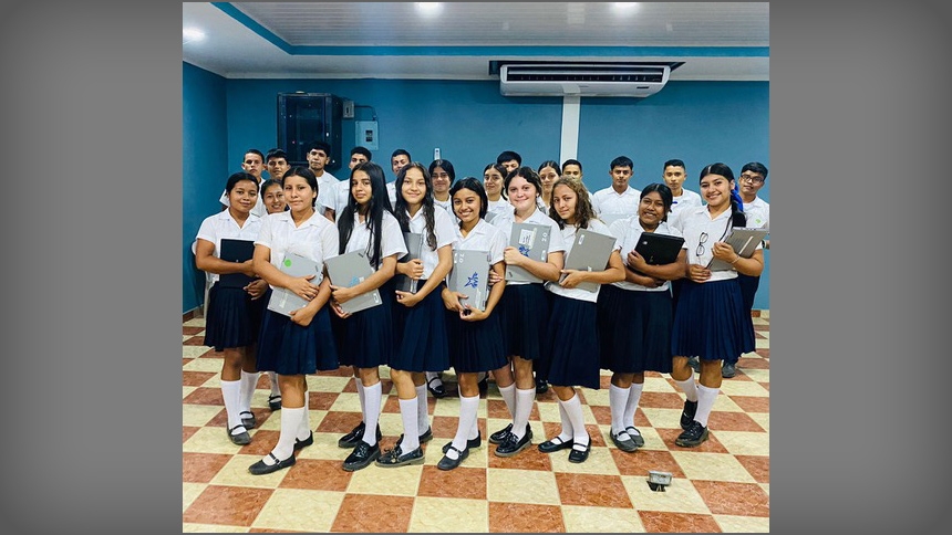 A graduating class gathers for a photo in the education center built by the ministry at St. Michael Parish in Cary. 