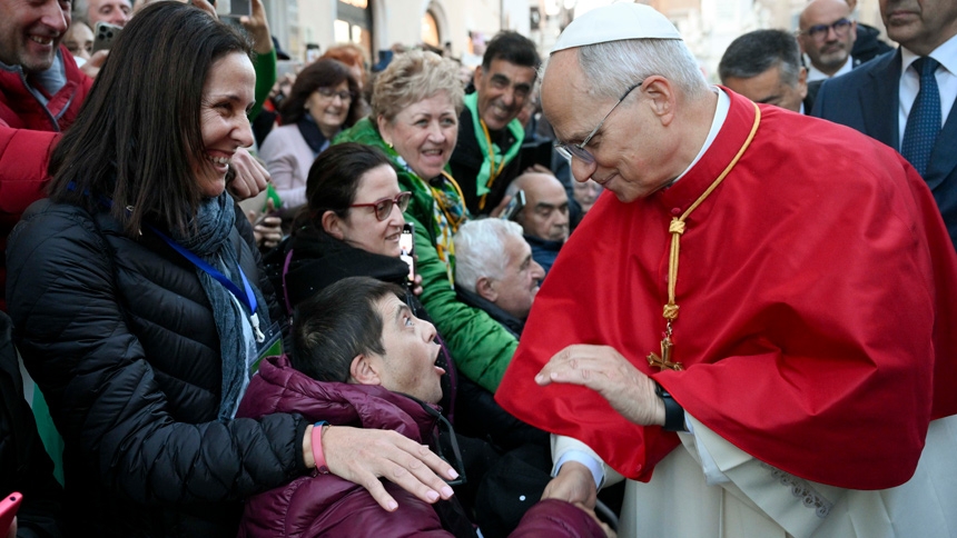 Pope Leo XIV greets people who came to pray with him by a Marian statue near the Spanish Steps in the center of Rome Dec. 8, 2025, the feast of the Immaculate Conception. (CNS photo/Vatican Media)