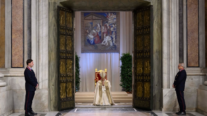 Pope Leo XIV kneels in prayer before closing the Holy Door at St. Peter's Basilica at the Vatican Jan. 6, 2026, marking the end of the Holy Year. (CNS photo/Vatican Media)