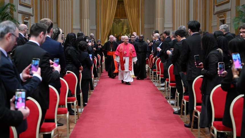 Pope Leo XIV walks down the aisle to meet with members of the diplomatic corps accredited to the Vatican at the Apostolic Palace at the Vatican Jan. 9, 2026. (CNS photo/Vatican Media)