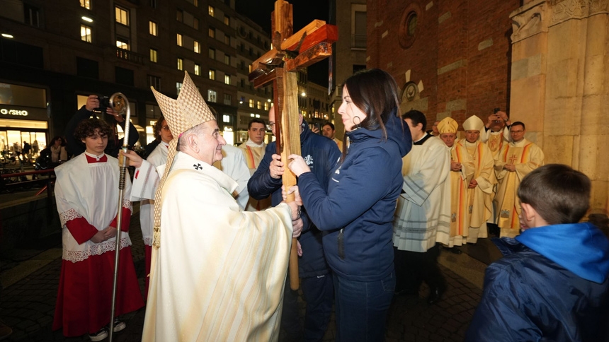 Members of Athletica Vaticana, the Vatican's sports association, hand the "Cross of Athletes" to Archbishop Mario Delpini of Milan Jan. 29, 2026, before Mass at the Basilica of San Babila, a week before the city hosts the 2026 Winter Olympics. (CNS photo/courtesy of the Archdiocese of Milan)