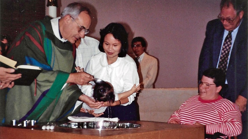 [Then] Father Staib baptizes Peter Nguyen at Immaculate Conception Church in Durham in 1992. 